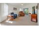 Bright living room with high ceilings and access to the screened patio at 26736 Cash Ct, Leesburg, FL 34748
