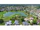 Picturesque neighborhood with a tranquil lake, golf course, and mature trees at 3049 Saint Thomas Ln, The Villages, FL 32162