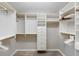 Walk-in closet with custom shelving and storage offers ample space and organization at 3049 Saint Thomas Ln, The Villages, FL 32162