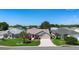 Charming single-story home featuring a well-manicured lawn and a brick-paved driveway at 3049 Saint Thomas Ln, The Villages, FL 32162
