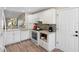 Modern kitchen featuring white cabinets, stainless steel appliances, and a stylish backsplash at 3049 Saint Thomas Ln, The Villages, FL 32162