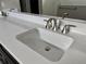 Close up of a bathroom vanity with a white countertop and a brushed-nickel faucet at 3070 Sunscape Ter, Groveland, FL 34736