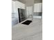 Close up of the new island featuring stainless steel faucet and white marble countertops at 3070 Sunscape Ter, Groveland, FL 34736