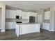 Spacious kitchen with ample storage and new stainless steel appliances and center island at 3070 Sunscape Ter, Groveland, FL 34736