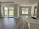View of an open living space with a sliding glass door and a view of the back yard at 3070 Sunscape Ter, Groveland, FL 34736