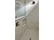 Modern shower with marble-look tile, a glass door and a built in niche at 3070 Sunscape Ter, Groveland, FL 34736