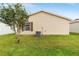 Home exterior with a lawn and vinyl siding at 312 Emmalee Pl, The Villages, FL 32162
