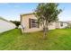 Home exterior with a lawn and vinyl siding at 312 Emmalee Pl, The Villages, FL 32162