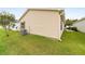 Home exterior showcases a well-maintained lawn and vinyl siding at 312 Emmalee Pl, The Villages, FL 32162