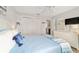 Bright bedroom with a comfortable bed, large closet doors, and soft decor at 312 Emmalee Pl, The Villages, FL 32162