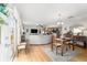 Open-concept dining area flows into the living room and modern kitchen at 312 Emmalee Pl, The Villages, FL 32162