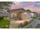 Inviting single-story home boasts a screened porch, attached garage, and manicured landscaping at 312 Emmalee Pl, The Villages, FL 32162