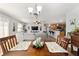 Open-concept living space with a dining area and modern kitchen in view at 312 Emmalee Pl, The Villages, FL 32162