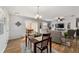 Bright open living area with a dining table and comfortable seating arrangement at 312 Emmalee Pl, The Villages, FL 32162