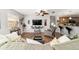 Open living room with hardwood floors, a ceiling fan, and comfortable seating at 312 Emmalee Pl, The Villages, FL 32162