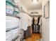 Spacious walk-in closet with organized storage solutions and hardwood flooring at 312 Emmalee Pl, The Villages, FL 32162