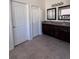Bathroom features a dual sink vanity with dark wood cabinets and tiled floors at 326 Crystal Pond Ave, Deland, FL 32720
