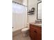 Well-lit bathroom featuring a tub-shower combination, toilet, and vanity with granite countertop at 326 Crystal Pond Ave, Deland, FL 32720