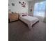 Bright bedroom features a queen bed, plush carpet, and natural light from large windows at 326 Crystal Pond Ave, Deland, FL 32720