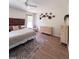 This bedroom features a wood accent wall, wood floors, and simple neutral decor at 326 Crystal Pond Ave, Deland, FL 32720