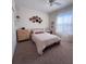 Bright bedroom features a queen bed, plush carpet, and natural light from large windows at 326 Crystal Pond Ave, Deland, FL 32720
