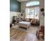 Bright living room featuring hardwood floors, natural light, and decorative furnishings at 326 Crystal Pond Ave, Deland, FL 32720
