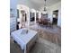 Open-concept living and dining area featuring hardwood floors, natural light, and comfortable seating at 326 Crystal Pond Ave, Deland, FL 32720