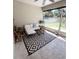Inviting screened-in patio with ample seating, plants and outdoor view, perfect for relaxation at 326 Crystal Pond Ave, Deland, FL 32720