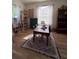 Well-lit study with hardwood floors, natural light, and ample space for work or learning at 326 Crystal Pond Ave, Deland, FL 32720