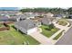 Well-maintained one-story home with attached garage, lush lawn, and a concrete driveway in a Gathering-friendly neighborhood at 3329 Boyd Cir, Oxford, FL 34484