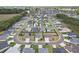A wide aerial view of a neighborhood that includes many well-kept properties at 3329 Boyd Cir, Oxford, FL 34484