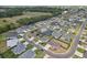 A beautiful aerial view of a residential neighborhood with well-kept lawns and tree-lined streets at 3329 Boyd Cir, Oxford, FL 34484