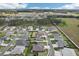 Aerial shot of a lovely neighborhood featuring cozy homes, green spaces, and a serene atmosphere at 3329 Boyd Cir, Oxford, FL 34484