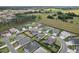 Aerial view of a peaceful neighborhood with well-manicured lawns and mature landscaping at 3329 Boyd Cir, Oxford, FL 34484