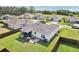 View of the backyard with a screened in patio and outdoor seating, offering a relaxing space at 3329 Boyd Cir, Oxford, FL 34484