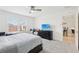 Spacious bedroom with television and view of the dining area at 3329 Boyd Cir, Oxford, FL 34484