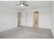 Bedroom featuring soft carpet, a closet, and access to the bathroom at 3329 Boyd Cir, Oxford, FL 34484