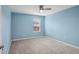Cozy bedroom with a ceiling fan and a window at 3329 Boyd Cir, Oxford, FL 34484
