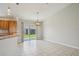 Bright dinette area with tile flooring and slider doors leading to the backyard at 3329 Boyd Cir, Oxford, FL 34484