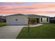 Charming single-story home with a two car garage, well-manicured lawn, and inviting curb appeal at 3329 Boyd Cir, Oxford, FL 34484
