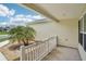 Charming covered front porch with a landscaped garden bed, providing a welcoming entryway at 3329 Boyd Cir, Oxford, FL 34484