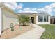 Charming single-story home with decorative lawn ornaments and a well-manicured walkway at 3329 Boyd Cir, Oxford, FL 34484