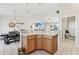 Open kitchen and dining area with granite countertops at 3329 Boyd Cir, Oxford, FL 34484