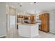 Well-equipped kitchen featuring stainless appliances, granite countertops, tile flooring and an island at 3329 Boyd Cir, Oxford, FL 34484