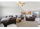 Open living space includes a spacious living room, dining area, and kitchen with bar seating at 3329 Boyd Cir, Oxford, FL 34484