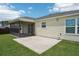 Corner view of a screened lanai and patio area, perfect for outdoor relaxation at 3329 Boyd Cir, Oxford, FL 34484
