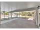 The screened patio overlooks the yard and has a view of the fenced pool at 3415 Sail Fish Ave, Fruitland Park, FL 34731