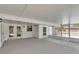 View of the home's screened patio leading to the backyard at 3415 Sail Fish Ave, Fruitland Park, FL 34731