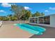 The pool is fenced and adjacent to the screened in patio at 3415 Sail Fish Ave, Fruitland Park, FL 34731