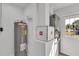 Utility room with water heater and HVAC system at 3415 Sail Fish Ave, Fruitland Park, FL 34731